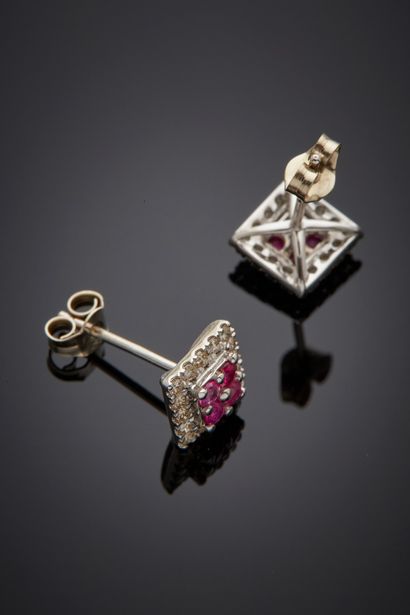null Pair of white gold (750‰) square EARRINGS set with four round rubies, surrounded...