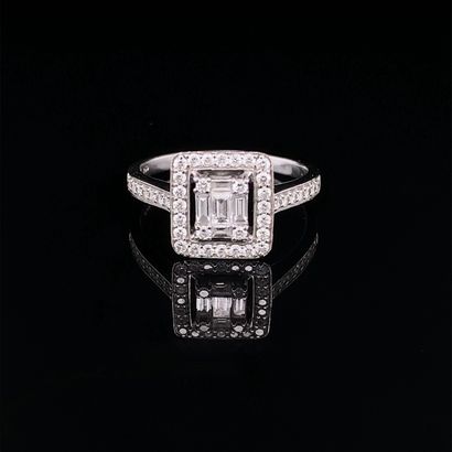 null White gold (750‰) rectangular ring set with baguette and brilliant-cut diamonds....