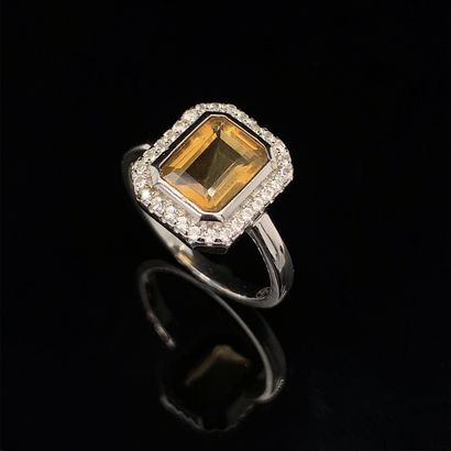 null Silver (925‰) octagonal ring set with a degree-cut citrine surrounded by white...
