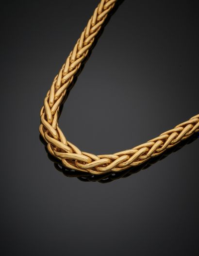 null COLLAR in yellow gold (750‰) with falling "palm tree" mesh. 
Length : 40 cm....