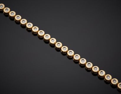 null BRACELET in yellow and white gold (750‰) set with an alignment of 40 brilliant-cut...