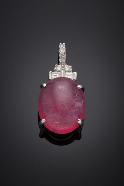 null White gold (750‰) pendant set with an oval cabochon-treated ruby, weighing approximately...