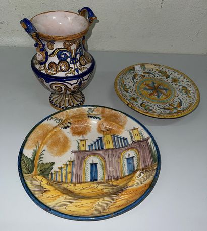 null Lot of polychrome faience including:
- earthenware footed cup decorated with...