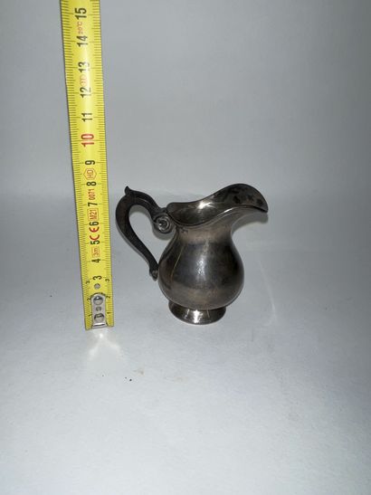 null Miniature metal milk jug