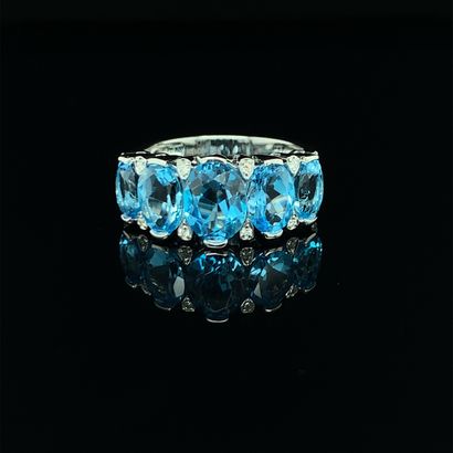 null RING in white gold (750‰) set with an alignment of five falling blue topazes,...