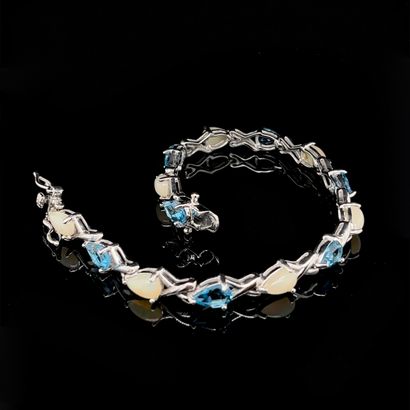 null BRACELET in silver (925‰) set with an alignment of alternating drop-shaped blue...