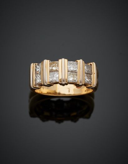 null Yellow and white gold (750‰) godronné ring set with eight princess-cut diamonds....
