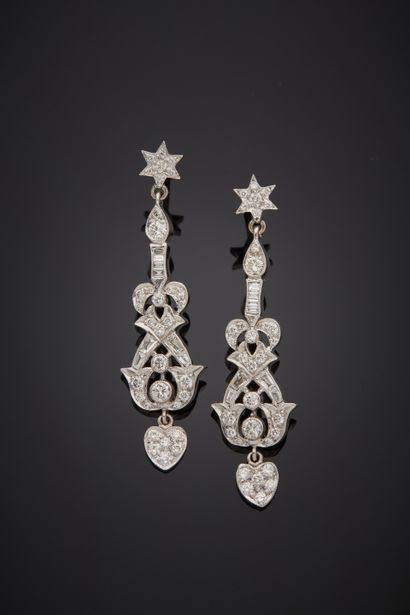 null Pair of white gold (750‰) openwork EAR PENDANTS with star, heart and scroll...
