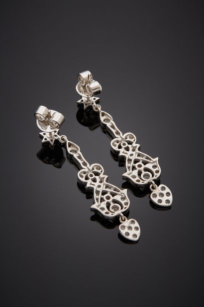 null Pair of white gold (750‰) openwork EAR PENDANTS with star, heart and scroll...