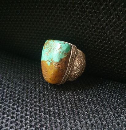 null Large hammered metal ring with foliage and scrolls and a large turquoise stone,...
