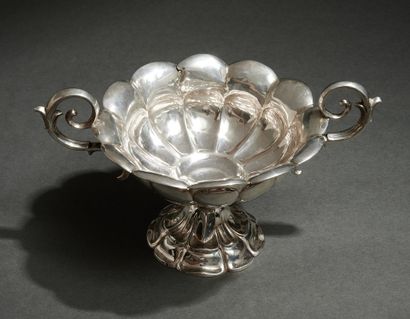 null A "flower" CUP with two "volute" handles, on a silver pedestal (min. 800‰) repoussé,...