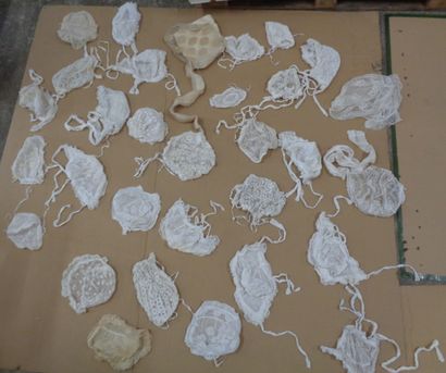 null Reunion of some thirty bonnets in embroidered linen or tulle