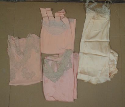 null Reunion of four pink or peach satin and crepe nightgowns with lace inlay.
