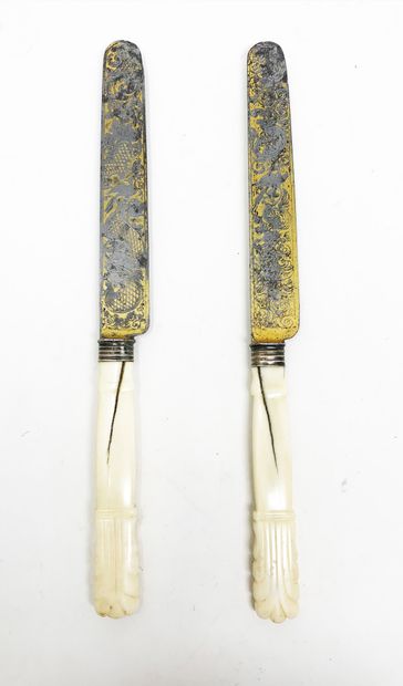 null Two table knives for a couple. Bone handles with engraved and gilded blades,...