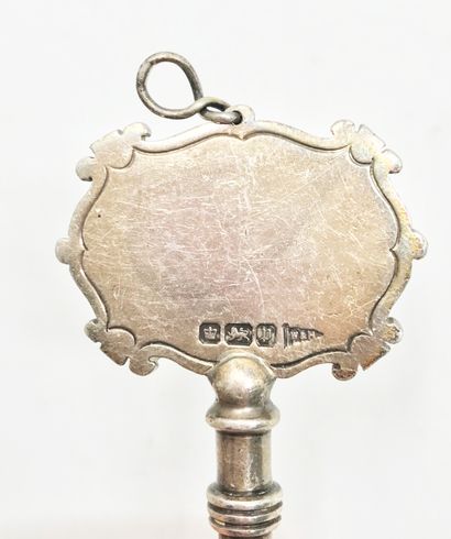 null Silver chamberlain's key, in the name of Ebenezer Don Carlos Bassett
English...