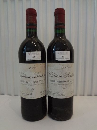 2 bouteilles de Château Boutisse, 1990, étiquettes...