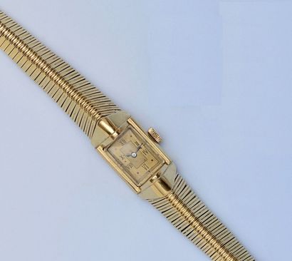 null Bracelet montre en or jaune 18 k (750 millièmes) pour femme. La montre de forme...
