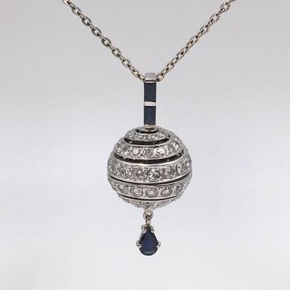 null PENDENTIF « boule » et sa chaînette en or gris (750 millièmes) entièrement serti...