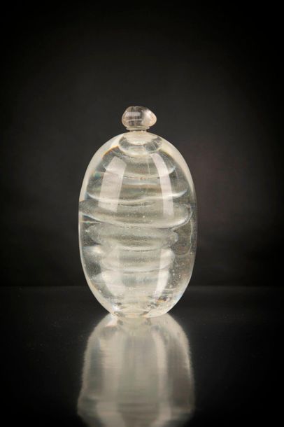 null Experimental bottle in pressed moulded blow-moulded glass with spiral decoration....