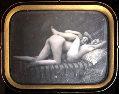 null [DAGUERREOTYPE - NAKED]. Two naked young women lying and embracing on a sofa,...