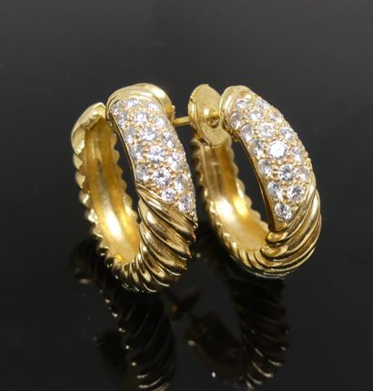 Pair of yellow gold earrings with twisted...