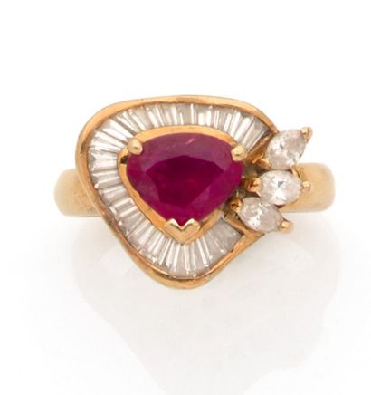 Yellow gold ring set with a heart-cut ruby...