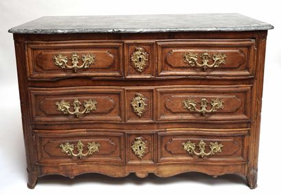 null A moulded and carved natural wood COMMODE, the front slightly curved, opening...