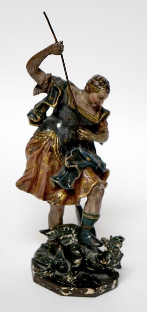  18th-19th century. SAINT-MICHEL slaying the dragon in polychrome and gilded wood....