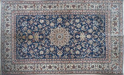 null ISPAHAN RUG, wool and silk, with central medallion on blue background. 252 x...