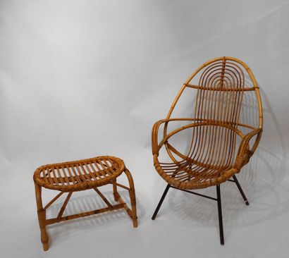 null Rattan armchair, rounded seat, black lacquered metal base. Circa 1960. A small...