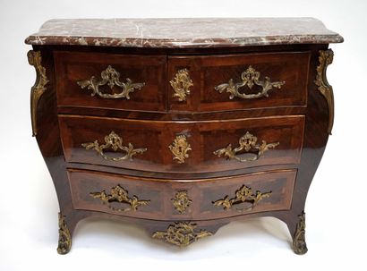  COMMODE, veneered with violet wood, the front opening to four drawers on three rows....