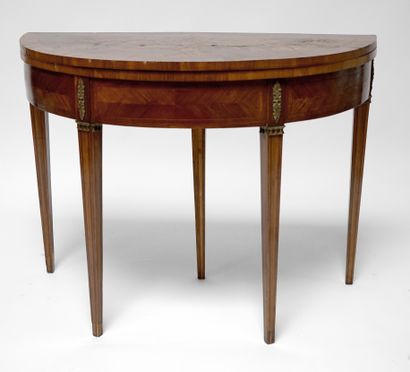  A half-moon veneer and flower marquetry table with a dark green felt top, standing...