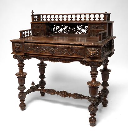  Carved oak desk with Renaissance-inspired decoration of foliage and chimeras, the...