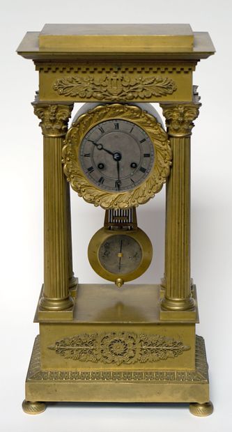  Gilt bronze portico clock, the silvered dial supported by four columns, the pediment...