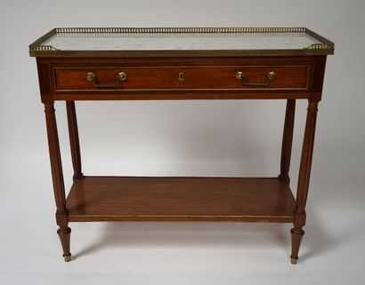 null Mahogany CONSOLE, the white veined marble top encircled by an openwork brass...