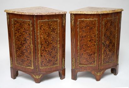  A pair of ENCOUNTERED BUFFETS in veneer and marquetry, opening with two curved doors,...