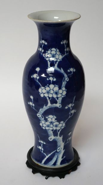 null Porcelain VASE with blue and white decoration of branch of prunus in reserve...