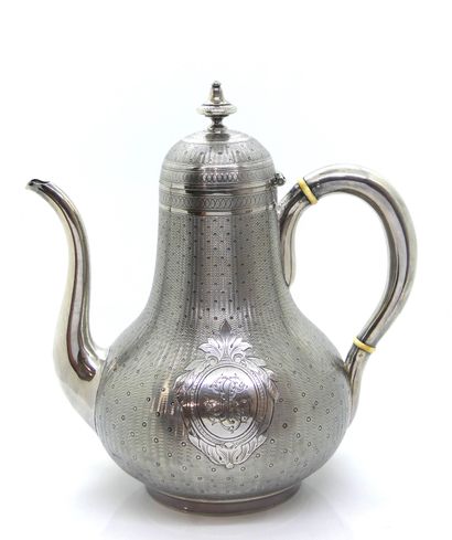 null 
A silver guilloche jug with lenses on a wavy background, numbered in a large...