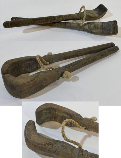 Interesting pair of wooden tongs in the shape...