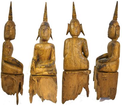 Bouddha en bois partiellement doré assis...