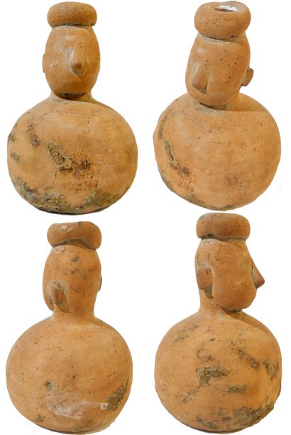 Rare terracotta bottle with a human head...