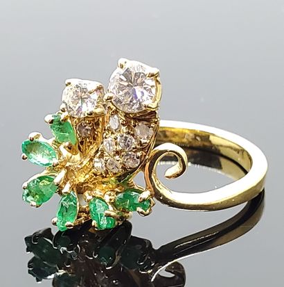 null Yellow gold ring, the asymmetrical bezel set with navette emeralds, pave diamonds...