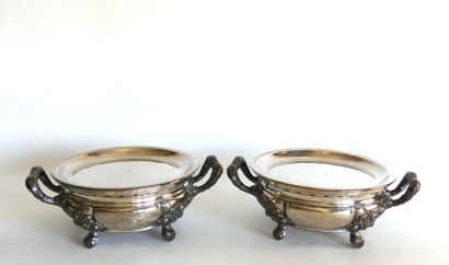 null Pair of silver plated HEATINGS with rich foliage decoration resting on four...