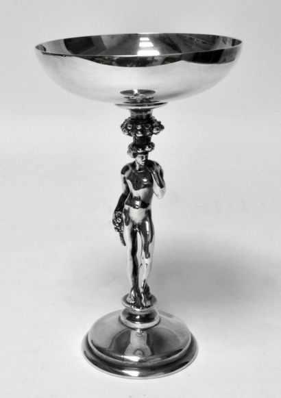 null CHRISTOFLE CUP in silver plated metal, on foot, representing BACCHUS holding...