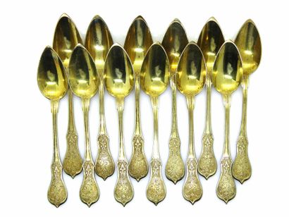 null Twelve coffee spoons in vermeil, the spatula scalloped with floral decoration....