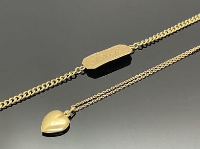 Yellow gold chain 750 mils, holding a heart...