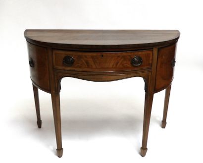 null Mahogany veneered half-moon CONSOLE, the front opening to a central drawer and...