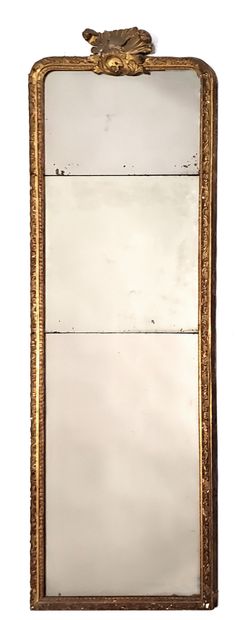 null High mirror in gilded stuccoed wood surmounted by a shell. Louis XV period....