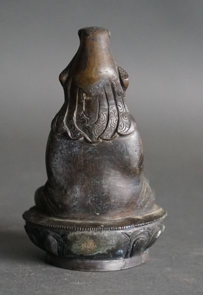 null CHINA or Tibet GUANYIN sitting in bronze with a light-brown shaded patina in...