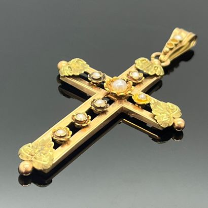 null 750 mils colored gold cross pendant set with half pearls. Late 19th century...